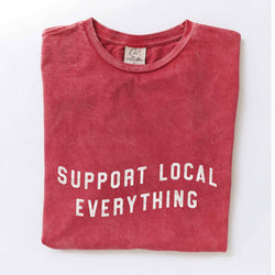 Red t-shirt with 'Support Local Everything' text on a white background