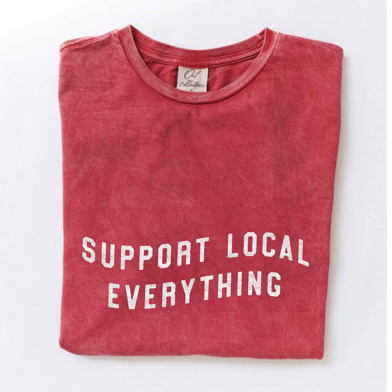 Red t-shirt with 'Support Local Everything' text on a white background